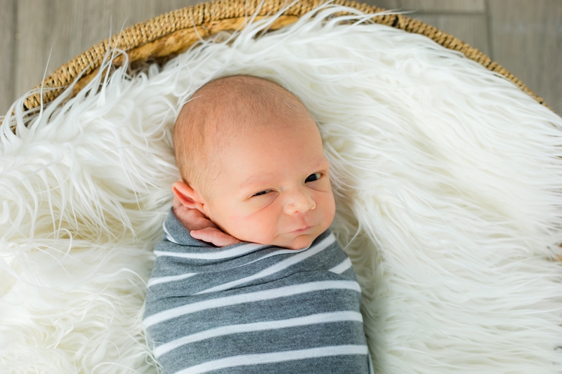 newborn boy smiling