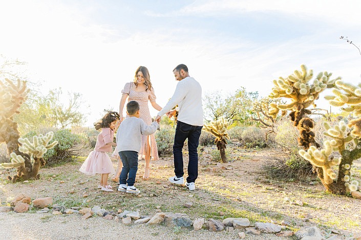 family playing ring around the rosie in scottsdale