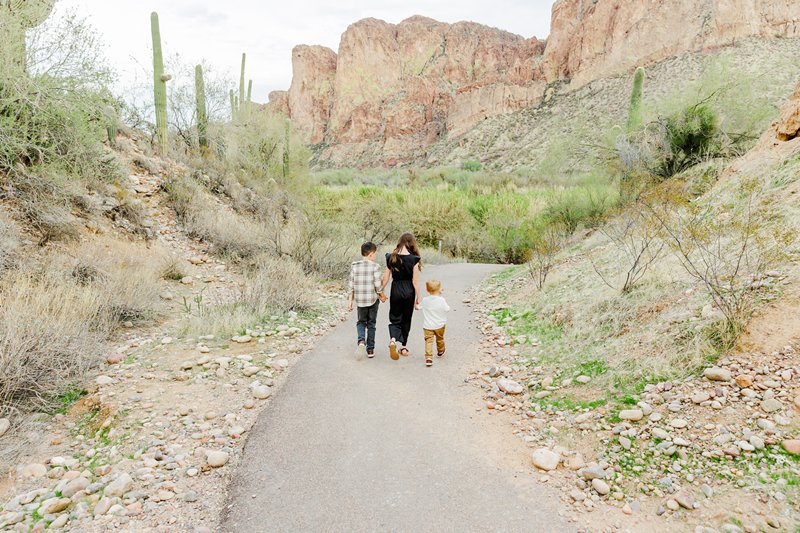 kids walking away holding hands on a path in Arizona