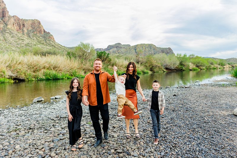 fun walking pose at a family session in arizona